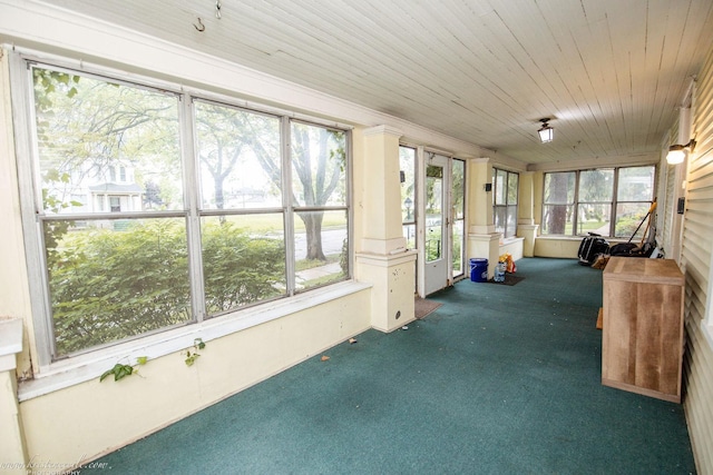 456 S Indiana Ave, Kankakee, IL 60901 - unfurnished sunroom featuring carpet flooring and ornate columns