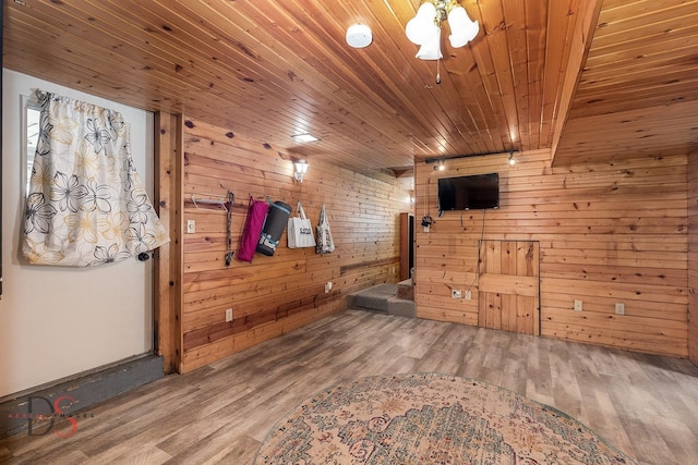907 Parks Ln, Ottawa, IL 61350 - unfurnished living room with wood ceiling, wooden walls, and wood finished floors