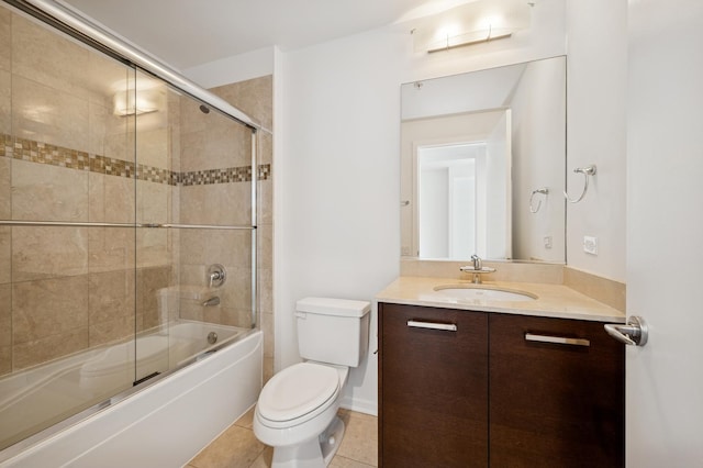 500 W Superior St Unit 805, Chicago, IL 60654 - bathroom featuring toilet, vanity, combined bath / shower with glass door, and tile patterned floors