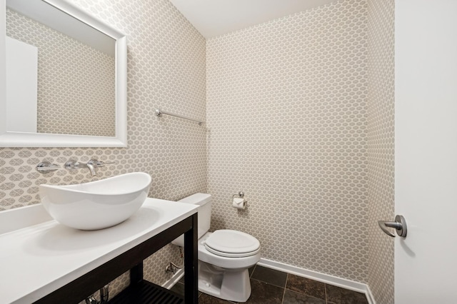 500 W Superior St Unit 805, Chicago, IL 60654 - half bathroom featuring toilet, vanity, and wallpapered walls