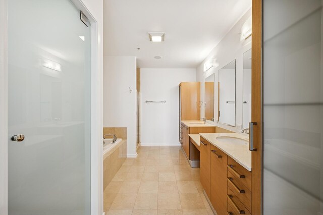 500 W Superior St Unit 805, Chicago, IL 60654 - full bath with two vanities, a garden tub, a shower stall, and tile patterned flooring