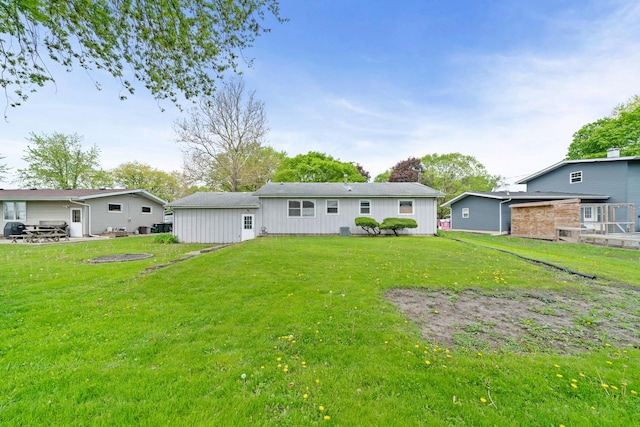 119 Cook Ct, Somonauk, IL 60552 - rear view of house with a lawn