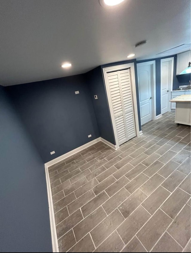 3628 N Nordica Ave, Chicago, IL 60634 - finished below grade area with baseboards, recessed lighting, and a sink