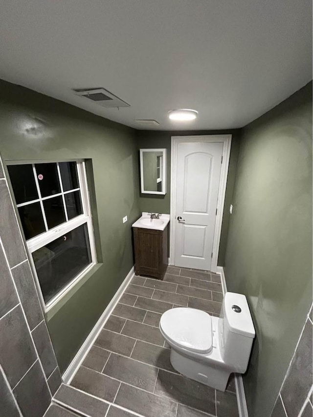 3628 N Nordica Ave, Chicago, IL 60634 - half bath with vanity, toilet, and baseboards