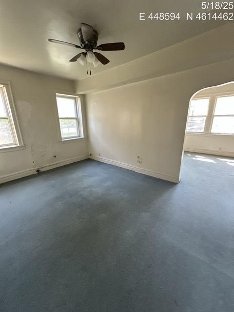 11739 S Indiana Ave, Chicago, IL 60628 - carpeted spare room featuring a ceiling fan and baseboards