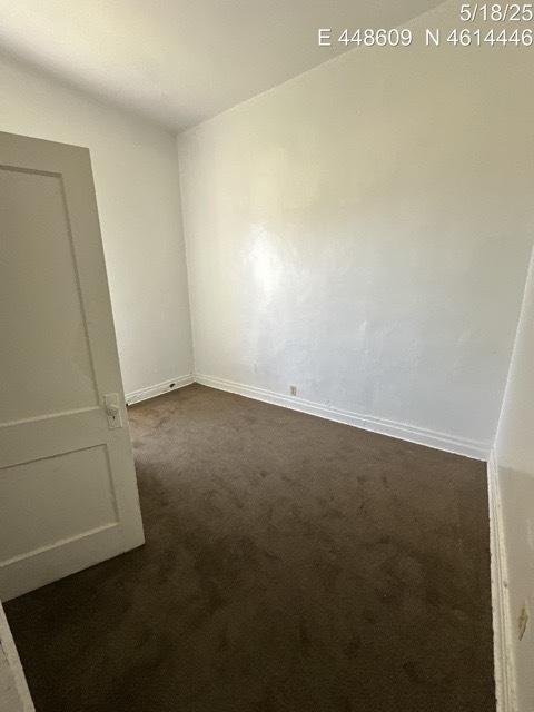 11739 S Indiana Ave, Chicago, IL 60628 - unfurnished room featuring dark carpet and baseboards