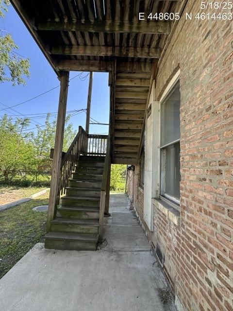 11739 S Indiana Ave, Chicago, IL 60628 - view of patio featuring stairway