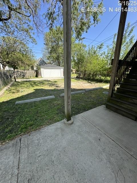 11739 S Indiana Ave, Chicago, IL 60628 - view of yard featuring stairs and a patio