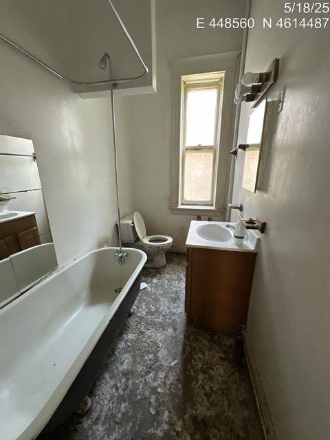 11739 S Indiana Ave, Chicago, IL 60628 - bathroom featuring vanity,  shower combination, and toilet