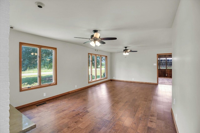 1651 Phillips Woods Ln, Urbana, IL 61802 - unfurnished room featuring healthy amount of natural light, ceiling fan, and wood finished floors