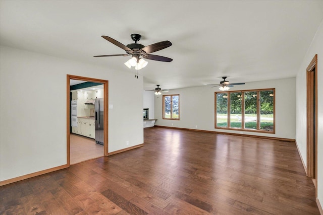 1651 Phillips Woods Ln, Urbana, IL 61802 - unfurnished living room with wood finished floors and ceiling fan