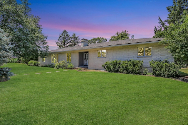 1651 Phillips Woods Ln, Urbana, IL 61802 - single story home with a lawn, brick siding, and a chimney