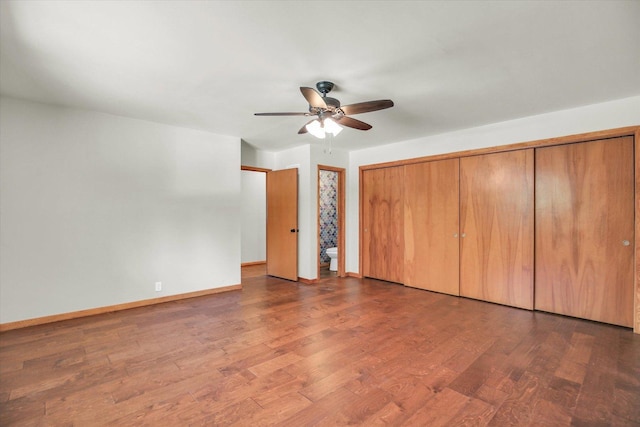 1651 Phillips Woods Ln, Urbana, IL 61802 - unfurnished bedroom featuring dark wood-type flooring and a ceiling fan
