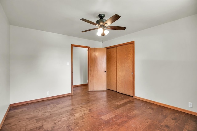 1651 Phillips Woods Ln, Urbana, IL 61802 - unfurnished bedroom featuring wood finished floors, a closet, and a ceiling fan