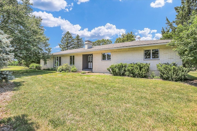 1651 Phillips Woods Ln, Urbana, IL 61802 - single story home featuring a front yard, brick siding, and a chimney