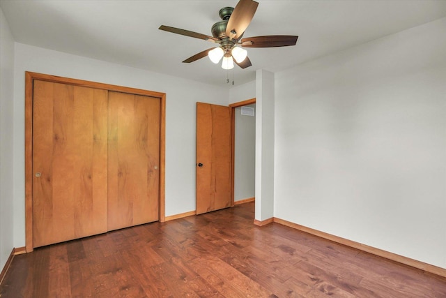 1651 Phillips Woods Ln, Urbana, IL 61802 - unfurnished bedroom with wood finished floors, a closet, and a ceiling fan