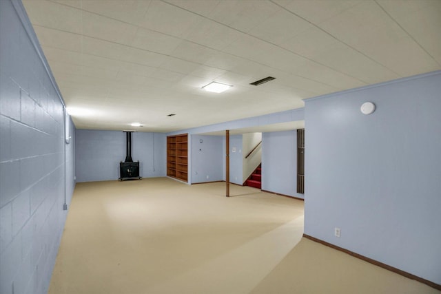 1651 Phillips Woods Ln, Urbana, IL 61802 - finished basement featuring a wood stove and stairway
