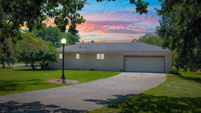 1651 Phillips Woods Ln, Urbana, IL 61802 - ranch-style house with driveway, an attached garage, a front lawn, brick siding, and crawl space