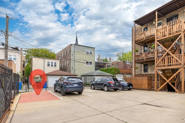 2316 W Cortez St Unit G, Chicago, IL 60622 - view of building exterior with uncovered parking and stairway