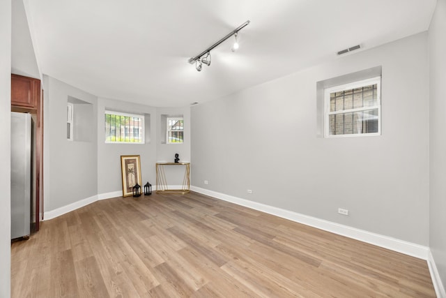 2316 W Cortez St Unit G, Chicago, IL 60622 - spare room featuring light wood-type flooring, baseboards, and track lighting