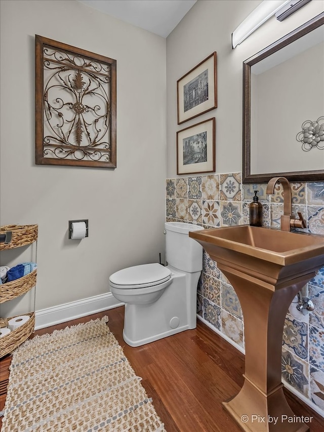 42W911 Jens Jensen Ln, Saint Charles, IL 60175 - half bath with toilet, wood finished floors, tile walls, a wainscoted wall, and baseboards