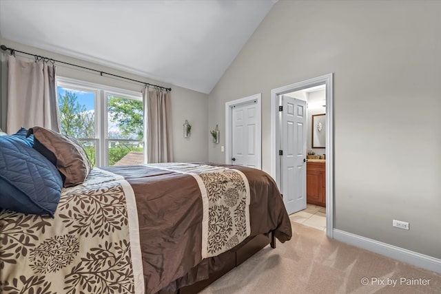 42W911 Jens Jensen Ln, Saint Charles, IL 60175 - bedroom featuring light carpet, high vaulted ceiling, ensuite bathroom, and baseboards