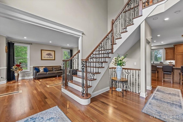 42W911 Jens Jensen Ln, Saint Charles, IL 60175 - stairway featuring healthy amount of natural light, wood finished floors, baseboards, and recessed lighting