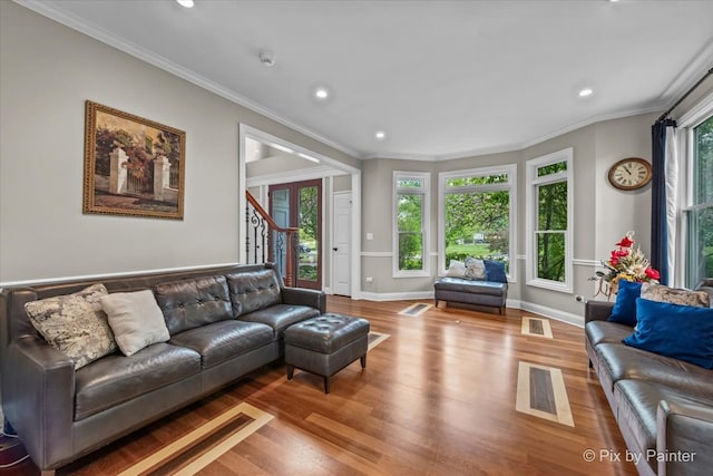 42W911 Jens Jensen Ln, Saint Charles, IL 60175 - living room with plenty of natural light, wood finished floors, recessed lighting, ornamental molding, and baseboards