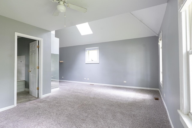 2908 Oakwood Ave, Mchenry, IL 60051 - spare room with carpet, a ceiling fan, a skylight, baseboards, and vaulted ceiling