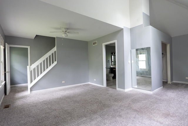 2908 Oakwood Ave, Mchenry, IL 60051 - unfurnished living room featuring ceiling fan, stairs, carpet floors, and baseboards
