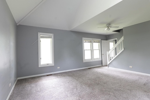 2908 Oakwood Ave, Mchenry, IL 60051 - carpeted spare room featuring ceiling fan, stairs, baseboards, and lofted ceiling