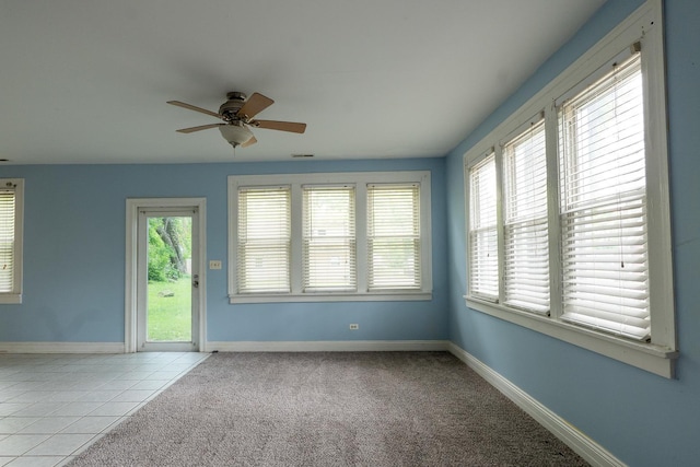 2908 Oakwood Ave, Mchenry, IL 60051 - carpeted empty room with ceiling fan, baseboards, and tile patterned floors
