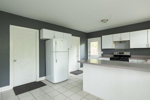 2908 Oakwood Ave, Mchenry, IL 60051 - kitchen featuring gas range, freestanding refrigerator, white cabinetry, a peninsula, and light tile patterned flooring