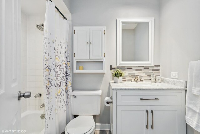 520 Shorely Dr Unit 201, Barrington, IL 60010 - bathroom featuring toilet, vanity, shower / bathtub combination with curtain, and decorative backsplash