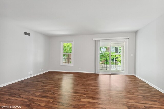 520 Shorely Dr Unit 201, Barrington, IL 60010 - spare room featuring healthy amount of natural light, dark wood finished floors, and baseboards