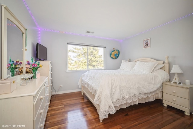 1130 Westminster Ln Unit 1130, Elk Grove Village, IL 60007 - bedroom with dark wood-style floors and baseboards