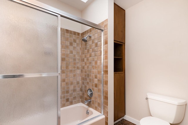 244 Greenwood N, Dekalb, IL 60115 - bathroom with toilet, bath / shower combo with glass door, and baseboards