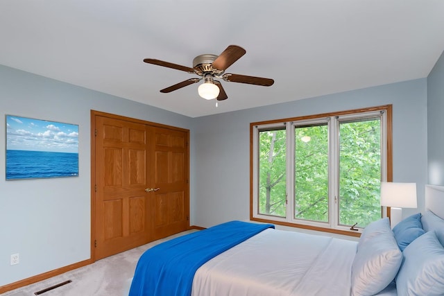 244 Greenwood N, Dekalb, IL 60115 - bedroom with baseboards, light colored carpet, and ceiling fan