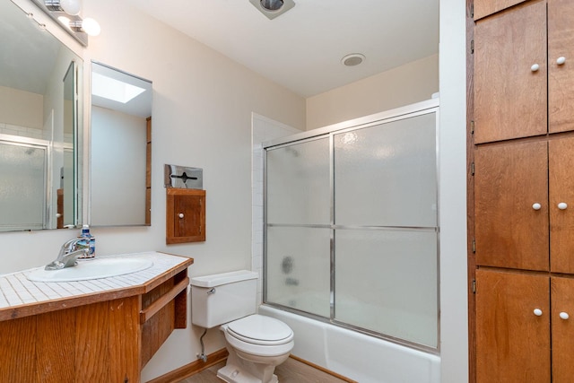 244 Greenwood N, Dekalb, IL 60115 - full bath with toilet, vanity, and shower / bath combination with glass door
