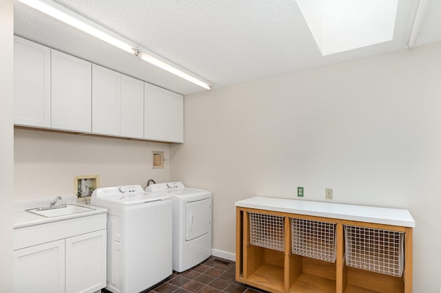 244 Greenwood N, Dekalb, IL 60115 - laundry room featuring cabinet space, washing machine and dryer, and a skylight