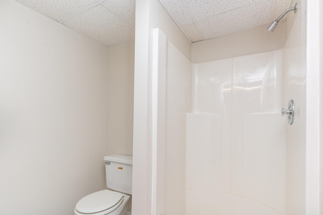 244 Greenwood N, Dekalb, IL 60115 - bathroom with a paneled ceiling, a shower, and toilet