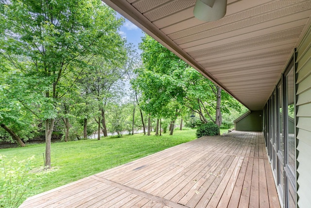 244 Greenwood N, Dekalb, IL 60115 - wooden deck with a water view, view of scattered trees, and a yard