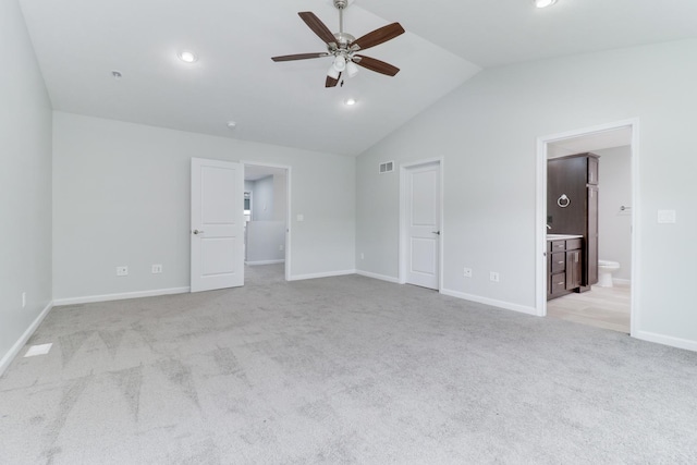 1406 Woodbine Rd Unit 1, Bloomington, IL 61704 - unfurnished bedroom with lofted ceiling, light colored carpet, baseboards, ensuite bathroom, and recessed lighting