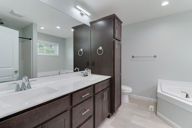 1406 Woodbine Rd Unit 1, Bloomington, IL 61704 - bathroom featuring a bath, double vanity, baseboards, toilet, and recessed lighting