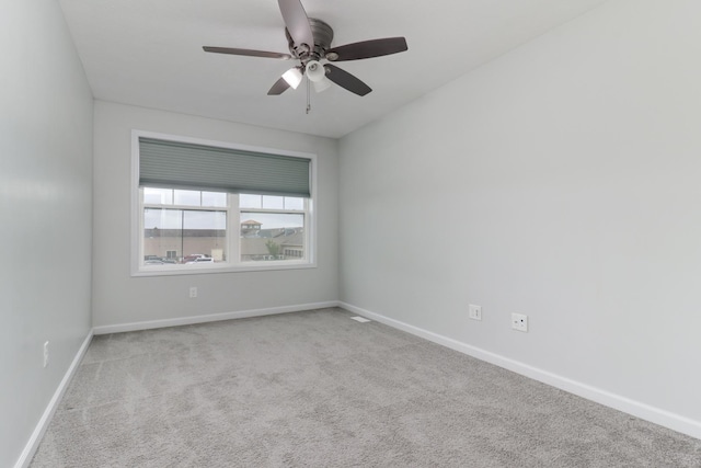 1406 Woodbine Rd Unit 1, Bloomington, IL 61704 - spare room with carpet flooring, a ceiling fan, and baseboards