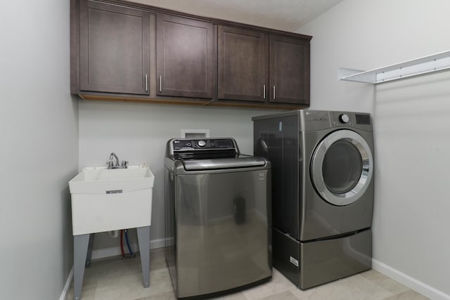 1406 Woodbine Rd Unit 1, Bloomington, IL 61704 - laundry room featuring separate washer and dryer, baseboards, and cabinet space