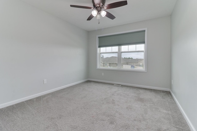 1406 Woodbine Rd Unit 1, Bloomington, IL 61704 - carpeted empty room with ceiling fan and baseboards
