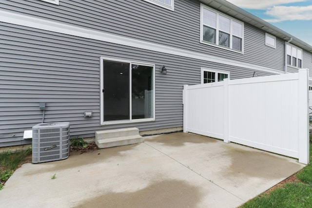 1406 Woodbine Rd Unit 1, Bloomington, IL 61704 - rear view of house with a patio area and central air condition unit
