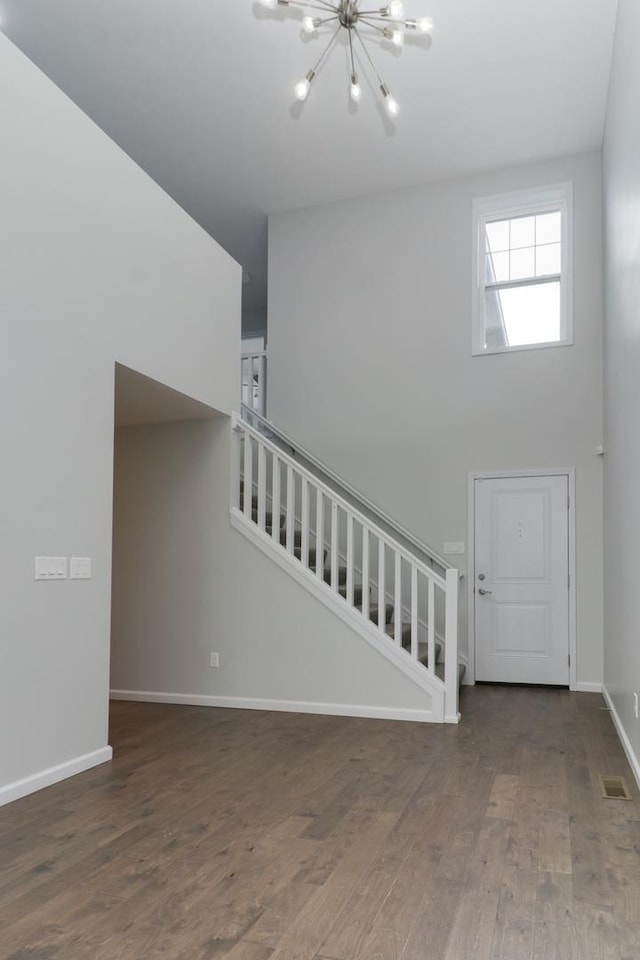 1406 Woodbine Rd Unit 1, Bloomington, IL 61704 - foyer entrance featuring stairs, a chandelier, wood finished floors, and baseboards