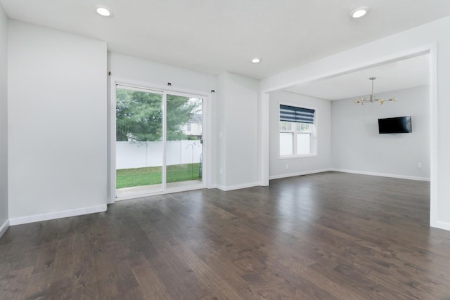 1406 Woodbine Rd Unit 1, Bloomington, IL 61704 - unfurnished room featuring a chandelier, dark wood-style floors, recessed lighting, and baseboards